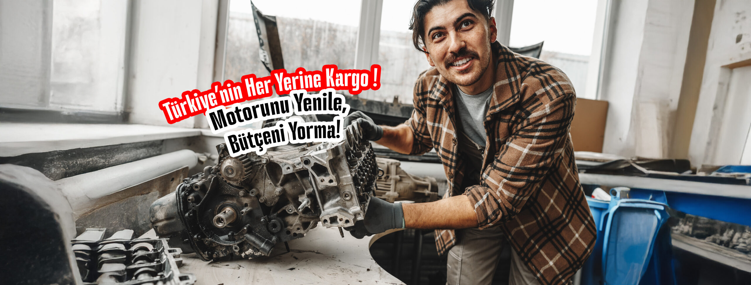 Workman disassembling car engine at the working table of the car service garage close up